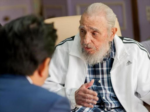 Cuba's former President Fidel Castro (R) and Japan's Prime Minister Shinzo Abe meet in Havana, Cuba, September 22, 2016, in this handout photo provided by Cubadebate. Photo/Reuters