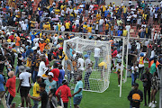 Orlando Pirates fans storm the pitch after the MTN8 second-leg semifinal victory against Mamelodi Sundowns at Peter Mokaba Stadium in Polokwane on October 22.