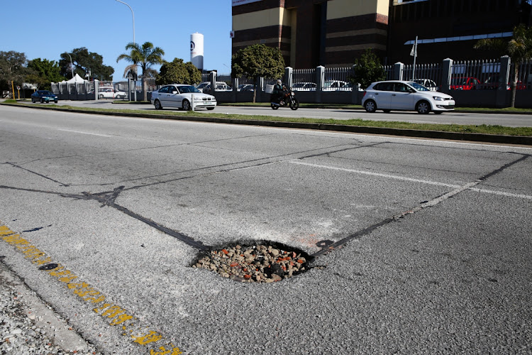 A large pothole is shown in Rochelle Road in Greenacres, Gqeberha.