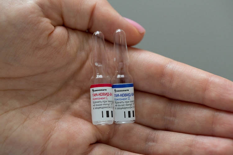 A handout photo shows an employee demonstrating vials with "Gam-Covid-Vac" vaccine against the coronavirus disease (Covid-19), developed by the Gamaleya National Research Institute of Epidemiology and Microbiology and the Russian Direct Investment Fund.