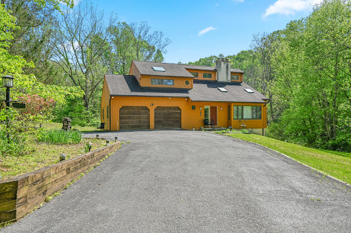 Orange house with double garage and garden in this luxury house for sale in Kennett Square ($695,000)