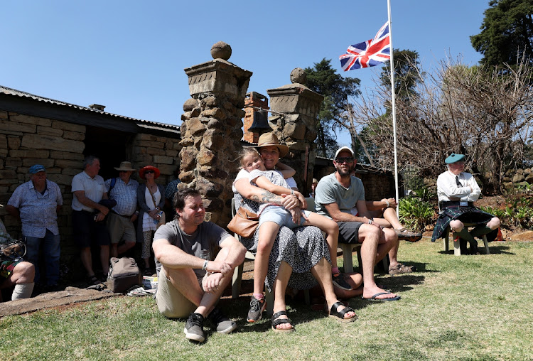 People watching a band performing at the 10th Fort Nottingham Highland Gathering in Nottingham outside Pietermaritzburg, KwaZulu-Natal, where a moment of silence was observed and the British and South African flags flown at half-mast to mourn the passing of Queen Elizabeth.