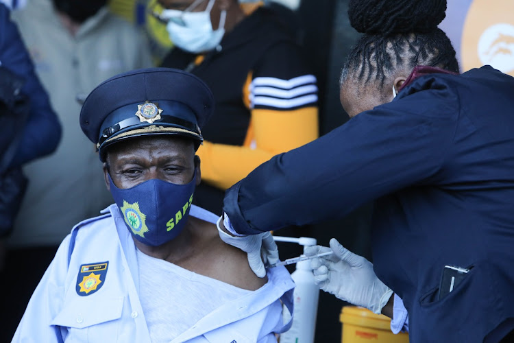 National police commissioner Gen Khehla Sitole receives his Covid-19 vaccine at Orlando Stadium.