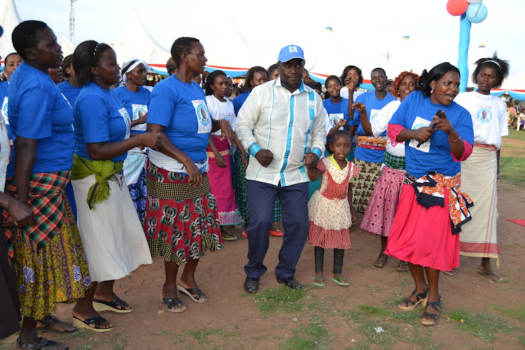 Kitui Senator Enoch Wambua joins a dancing troupe for a jig during a past function in Kitui County.