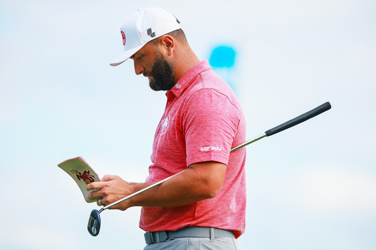 Captain Jon Rahm of Legion XIII makes notes during day two of the LIV Golf Invitational at Mayakoba at El Camaleon on February 3, 2024 in Playa del Carmen, Mexico.