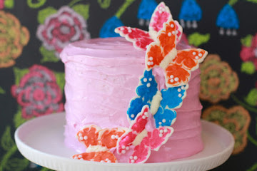 White Velvet Cake with Strawberry Buttercream Frosting and Chocolate Butterflies
