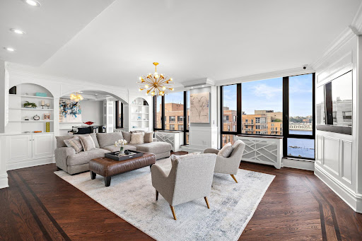 Modern living room with river view in this luxury apartment / penthouse for sale in Hoboken ($5,750,000 - 334 m²)