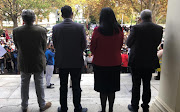 Marchers are greeted at the Stellenbosch University administration building on May 19 2022 by, from left, vice-chancellor and rector Wim de Villiers and deputy vice-chancellors Deresh Ramjugernath, Hester Klopper and Nico Koopman.