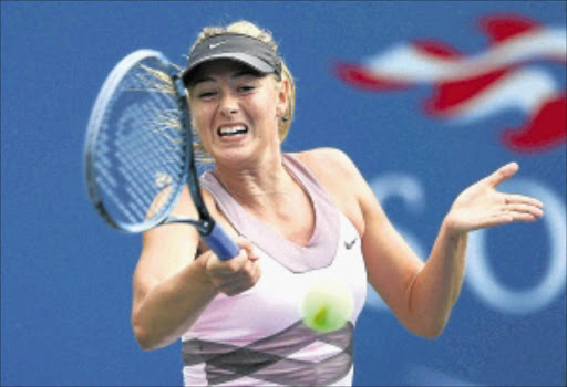 NOT PREGNANT : Maria Sharapova plays a forehand during her women's singles first round match against Melinda Czink during the US Open at the Arthur Ashe Stadium on Monday. Photo: Getty Images