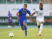 Feisal Salum Abdalla (left) of Tanzania is challenged by Fashion Sakala of Zambia during the 2023 Africa Cup of Nations match at Laurent Pokou Stadium in San Pedro, Ivory Coast.