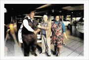 BIG DAY: Vaal taxi operator Josias Masenya and his wife Nthabiseng accept the keys to their brand-new Toyota Quantum  from Johan  Rossouw, centre, of Vaal Toyota way back in January 2011   photo: supplied