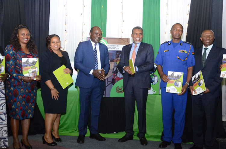 Registrar of political parties Ann Nderitu, IEBC vice chairperson Juliana Cherera, chairperson Wafula Chebukati, DPP Noordin Haji, Kenya Police Deputy IG Edward Mbugua and Dominic Kisavi at KICC on Friday