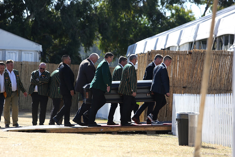 James Small's coffin is carried in ahead of his memorial service in Johannesburg on Thursday July 18 2019.