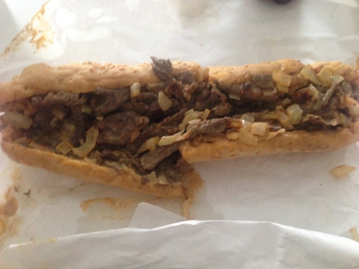 Cheese steak with onions and cheese wiz on a GF roll.