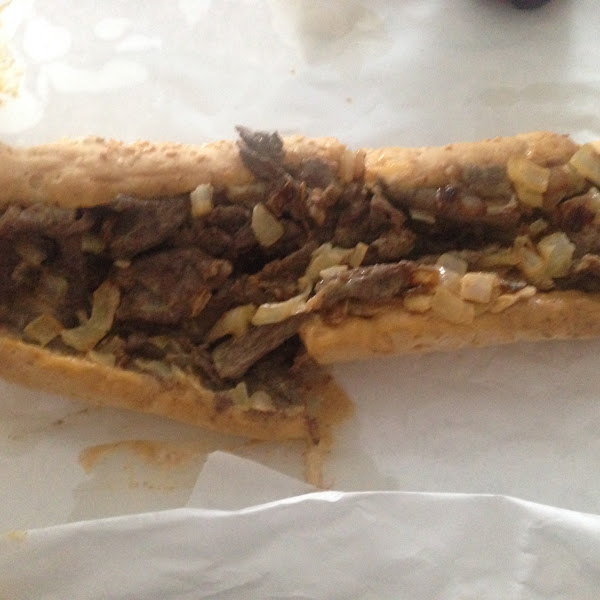 Cheese steak with onions and cheese wiz on a GF roll.