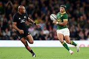 Springbok winger Kurt-Lee Arendse makes a break ahead of Mark Telea of New Zealand during their World Cup warm-up match at Twickenham Stadium on August 25, 2023 in London, England. 
