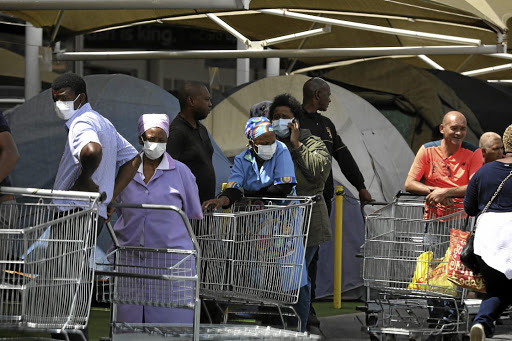 Makro customers in Roodepoort queuing to buy groceries and other items before 21 days of lockdown in SA due to the coronavirus pandemic that has raged across the globe. /ANTONIO MUCHAVE