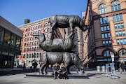 “The Last Three”, a bronze sculpture of the last surviving Northern White Rhinos in the world, has sparked controversy after it was unveiled in New York last week. Art critic Jerry Saltz asked why one of the animals is upside down and described the sculpture as “mad-ugly” and a “kitsch monstrosity”. 