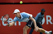 Kevin Anderson of South Africa runs down a return against Gilles Muller of Luxembourg during their first round match at the Japan Open tennis tournament in Tokyo on October 6, 2015.