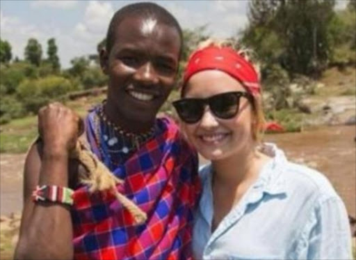 Demi Lovato during her Kenyan trip, posing with a Maasai man