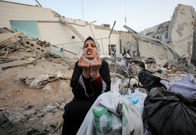 A woman reacts as she inspects the damage at al-Shifa Hospital in Gaza City, April 1 2024. Picture: REUTERS/DAWOUD ABU ALKAS