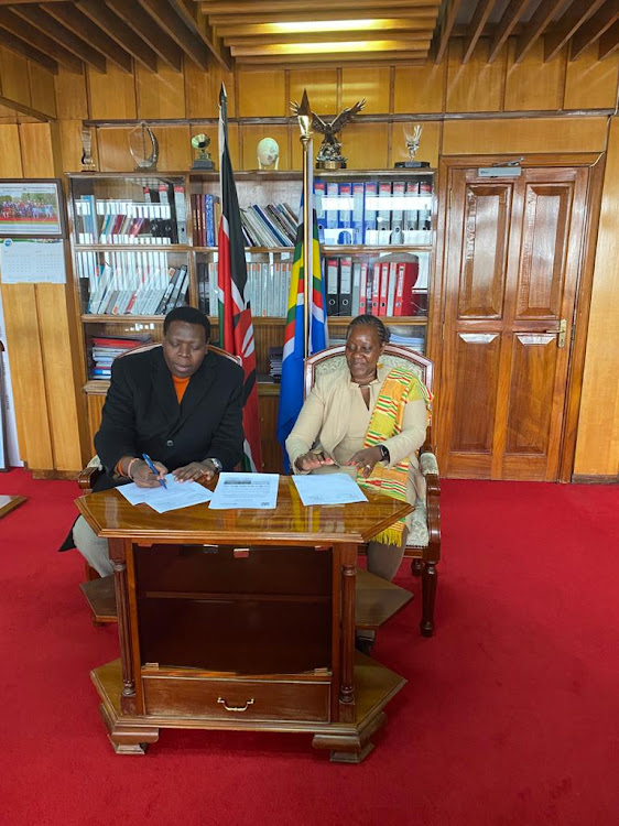 CS for Devolution and ASAL Eugene Wamalwa and FAO representative to Kenya Carla Mucavi, sign an action plan to combat drought in ASAL counties.