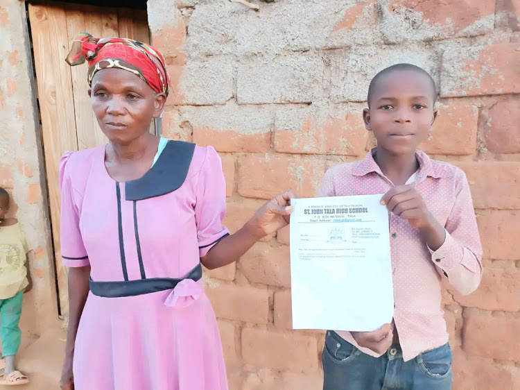 Luciah Masaa and her son in their Kakululo home in Mwingi west