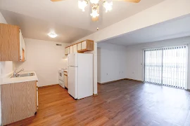 Dining room with view of galley kitchen and living room