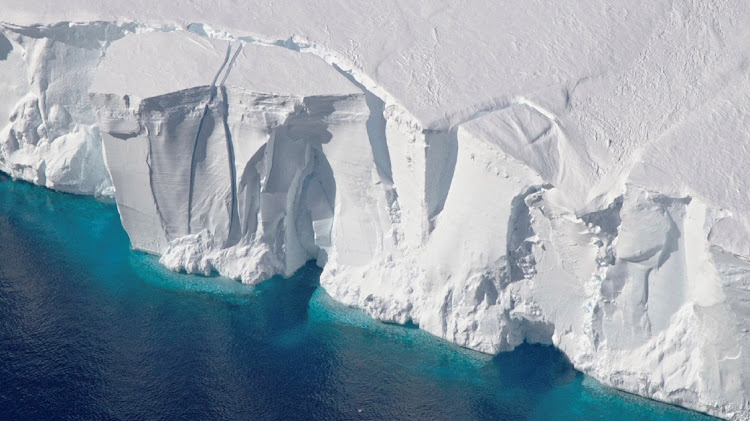 An aerial view of the 60-metre-tall front of the Getz Ice Shelf with cracks, in Antarctica, in this 2016 handout image. Picture: REUTERS/NASA