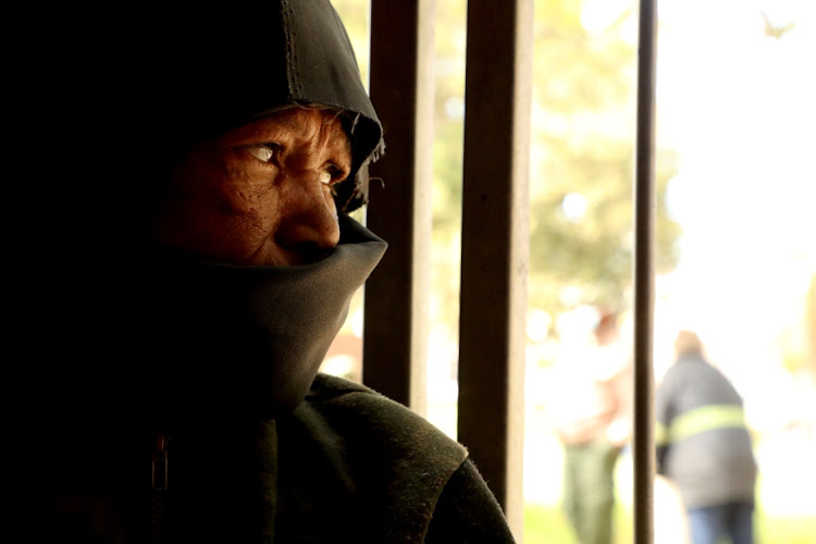 LIFE INSIDE: Joan Witbooi, 51, looks out from her temporary shelter at the Walmer Town Hall, one of the venues the Nelson Mandela Bay municipality is using to host scores of homeless people in the city during the national lockdown