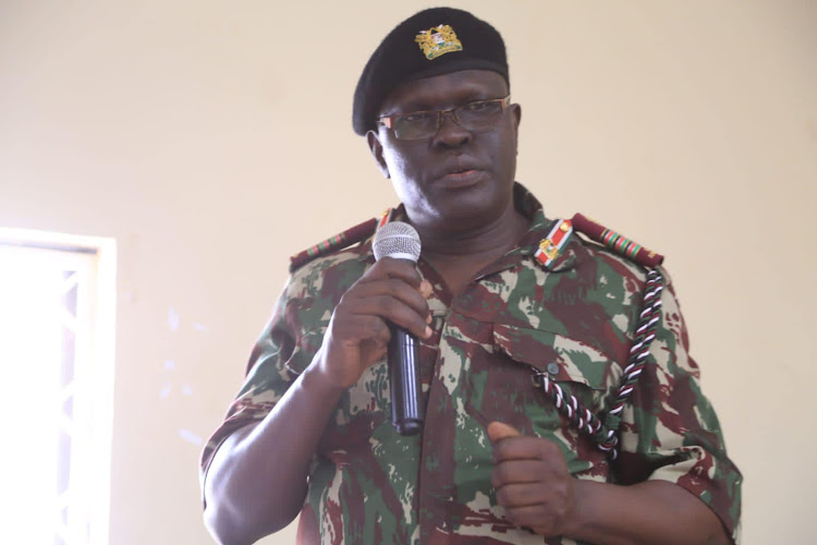 Northeastern regional commissioner John Otieno speaking in Rhamu town.