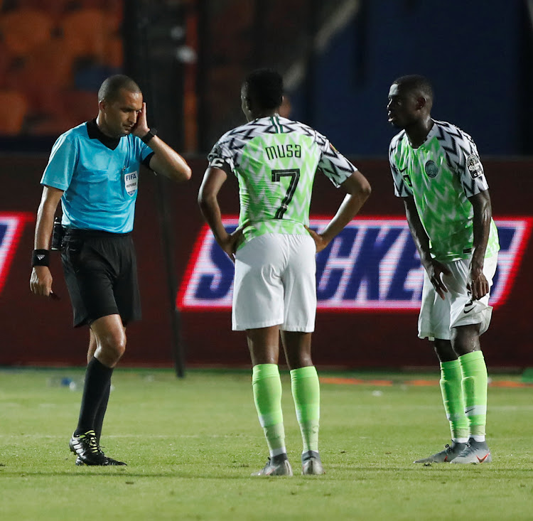 Referee Jiyed Redouane during a VAR review before awarding a goal to South Africa against Nigeria