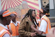 Controversial Artist Ayanda Mabulu argues with security at Sandton Square in Johannesburg after erecting one of his artworks showing President Jacob Zuma and Nelson Mandela in the shopping centre. 