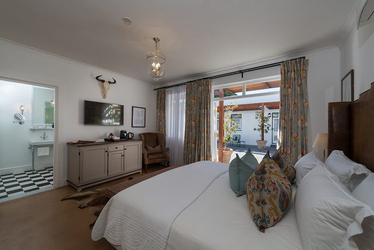 A stylish bedroom at the Drostdy Hotel