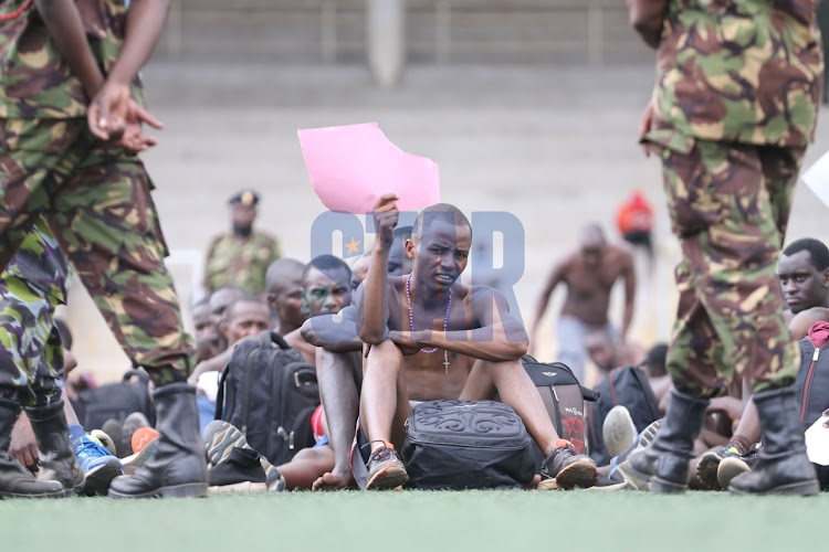 A recruit displays his selection sheet during the Kenya Defense Forces recruitment exercise at City Stadium which began today November 15, 2021. PHOTO/FREDRICK OMONDI