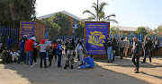 Outside the school gates where parents became embroiled in a scuffle earlier on Monday. 