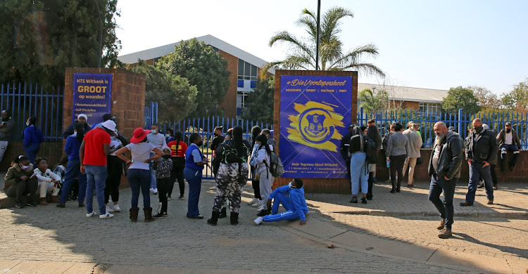 Outside the school gates where parents became embroiled in a scuffle earlier on Monday.