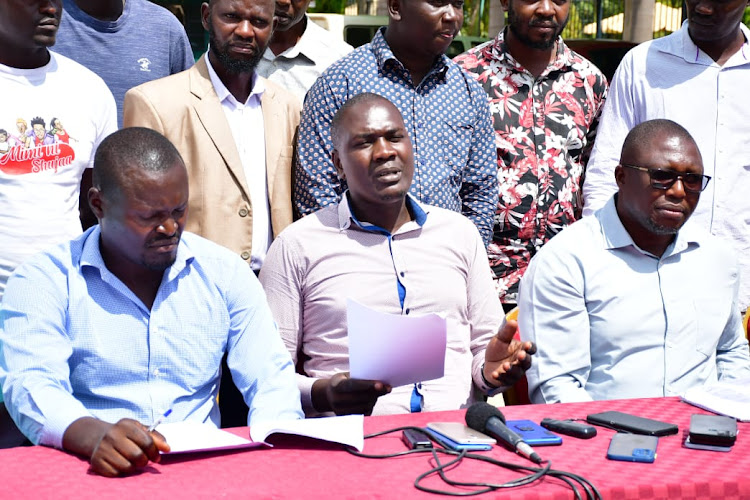 From L-R (sitting): Activists Vincent Obondo, Hillary Omondi and Chris Owala during a past press briefing on the state of governance in Siaya County.