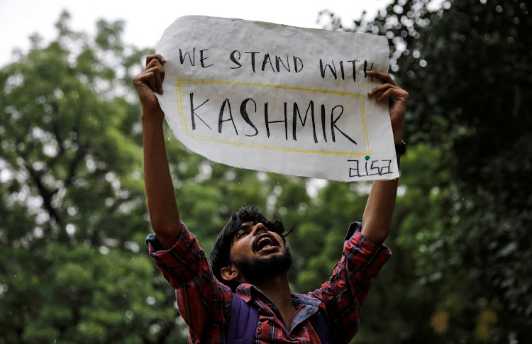 A man holds a sign and shouts slogans during a protest after the government scrapped the special status for Kashmir, in New Delhi, India, August 5, 2019. Picture: REUTERS / DANISH SIDDIQUI