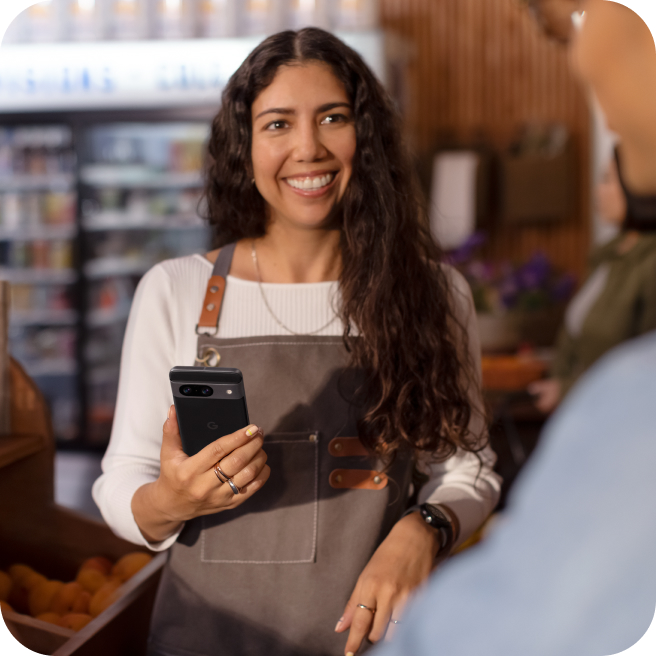 A woman working on a Google 8 Pro phone in her shop.