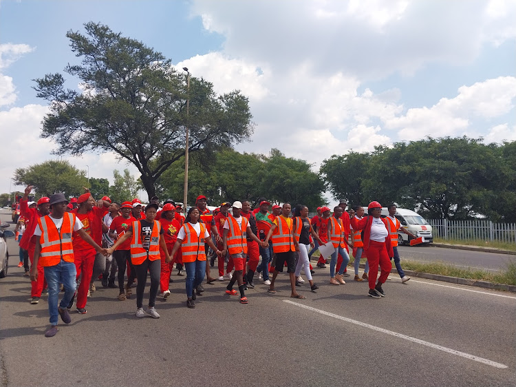 EFF supporters accusing Siemens of unfair labour practices picket outside the company's offices in Midrand.