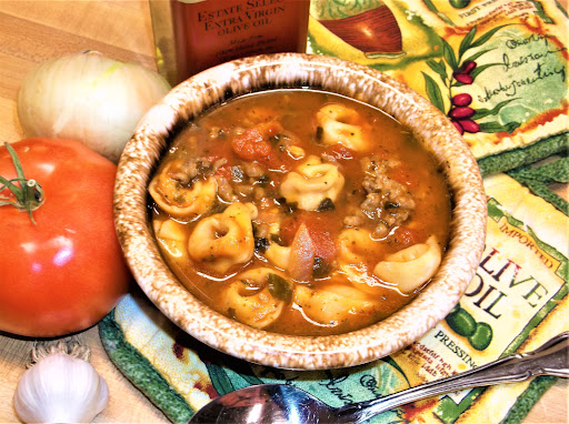 Hearty tortellini soup in bowl.