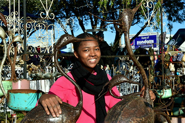 Emily Tigere, from Cape Town, showing off some of her metal crafts