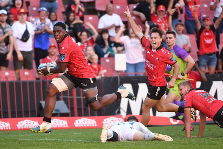 Emmanuel Tshituka of the Lions sprints clear in his team's 44-12 win over Leinster last weekend. Quan Horn celebrates while in support.