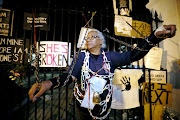 Venetia Orgill from Mitchells Plain spent Thursday night chained to the railings of parliament in Cape Town in a protest against gender violence.