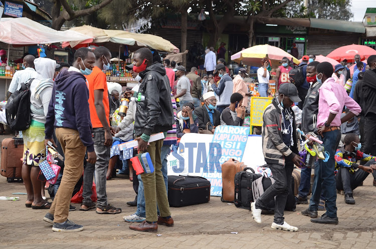 Kenyans awaiting for busses to travel to upcountry after president Uhuru Kenyatta orders on movement restrictions on five counties that was issued last week, at Machakos Country Nairobi, on March 28th 2021./DOUGLAS OKIDDY