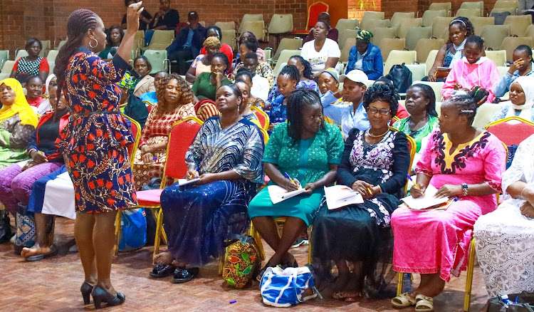 The Kenya Land Alliance CEO Faith Alubbe, a lawyer and and Human Rights activist, addresses women during the launch of the Haki Ardhi App on March 8, 2024.