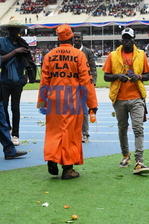 ODM supporters sing at Kasarani Stadium ahead of the Azimio La Umoja launch by ODM leader Raila Odinga on December 10, 2021.