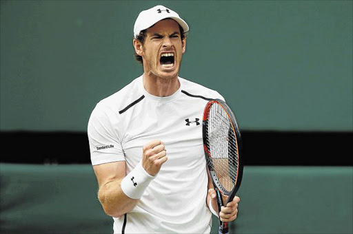 ROAR OF TRIUMPH: Andy Murray of Great Britain celebrates during the men’s singles final against Milos Raonic of Canada on day 13 of the Wimbledon Lawn Tennis Championships at the All England Lawn Tennis and Croquet Club in London yesterday Picture: GETTY IMAGES