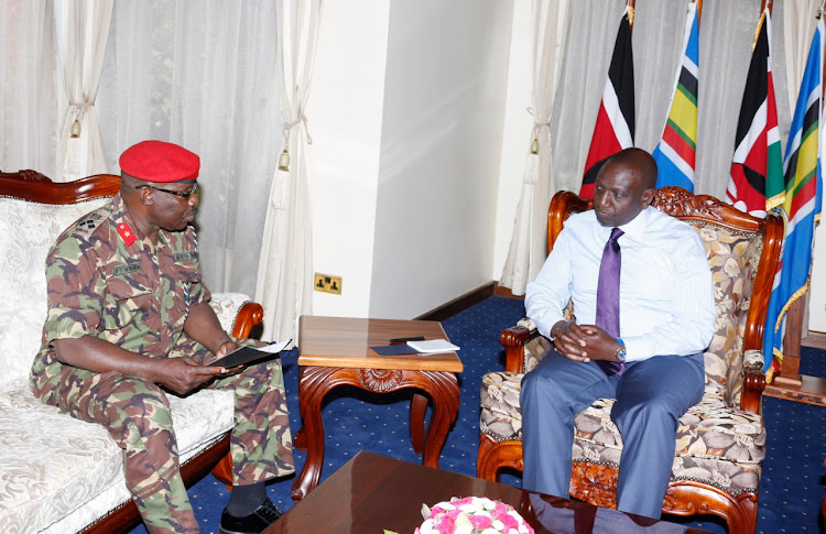 Brigidier Willy Wesonga from KDF briefing DP WIlliam Ruto at his Karen office this morning on final preparations for the burial of Mzee Moi ./DPPS